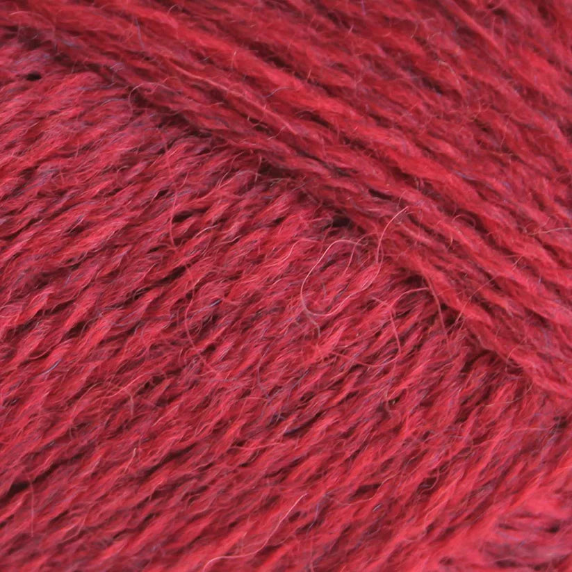 Close-up of red yarn with a textured surface