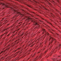 Close-up of red yarn with a textured surface