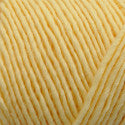 Light yellow yarn ball on a white background