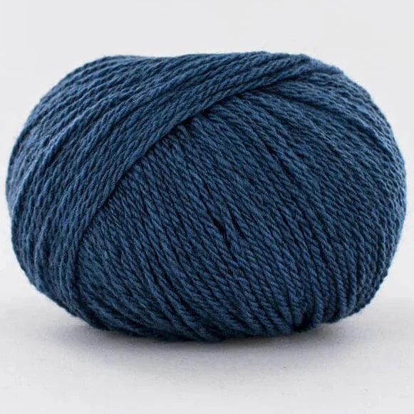 Blue skein of yarn on a white background