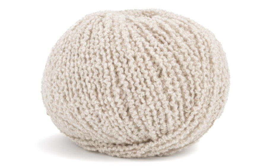 Knitted beige ball on a white background