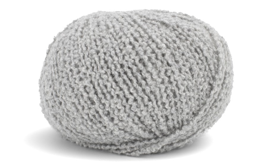 Gray knitted fabric ball on a white background